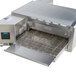 A TurboChef electric countertop conveyor oven with a metal surface.