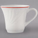A white Tuxton tall cup with a red rim and berry band.