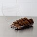 A Dart clear plastic hinged container filled with brown cookies.