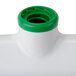 A white and green plastic Unger floor squeegee with a green cap.