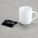 A black square Fineline Tiny Temptations tray holding a white mug.