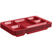 A stack of red Cambro 6 compartment trays.