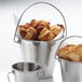 Three American Metalcraft stainless steel mini pails filled with food.
