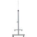 A white metal stand with a black pole attached to it.