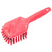 A red Carlisle Sparta utility and pot scrub brush with a handle.