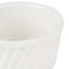 A close up of a CAC bone white fluted souffle bowl.
