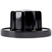A close-up of a black plastic cap for a Garland range dial.