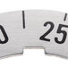 A close up of a metal dial insert with numbers.