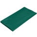 A package of 12 hunter green plastic table covers.