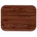 A rectangular wooden tray with a dark wood finish and a white border.