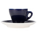 A CAC Venice blue espresso cup on a saucer with a blue rim.