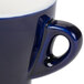 A CAC blue espresso cup with saucer on a white background.