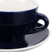 A CAC Venice blue and white cup and saucer.