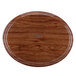 A wood oval Cambro tray with a round edge.