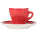 A close-up of a CAC Venice red espresso cup and saucer.