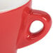 A close-up of a red CAC Venice espresso cup and saucer with a white background.