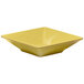 An Elite Global Solutions yellow square melamine bowl.