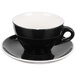 A black and white CAC Venice tea cup and saucer.