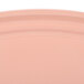 A close up of a dark peach oval plastic tray with a white border.