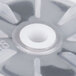 A close-up of a white plastic impeller with a grey circle on it.