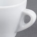 A close up of a white CAC E-3 Venice espresso cup with a saucer.