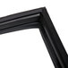 A close-up of a black rubber corner on a True 810772 equivalent magnetic door gasket.