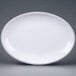 An Elite Global Solutions white oval plate with black trim.