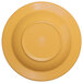 A yellow melamine bowl with a circle in the middle.