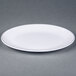 A white oval plate with black trim.