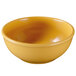A yellow Elite Global Solutions melamine bowl on a white background.