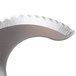 A close up of a metal Robot Coupe 27134 fine serrated "S" blade.