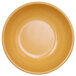 A close up of a yellow Elite Global Solutions Rio melamine bowl.