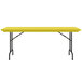 A yellow rectangular Correll R-Series plastic folding table with black legs.