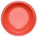 A close-up of a red melamine monkey dish with a white background.