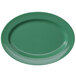An oval green melamine platter with a white background.