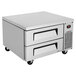A stainless steel Turbo Air two drawer refrigerated chef base on black wheels.