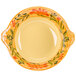 A yellow and orange bowl with a floral design.