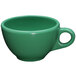 A close-up of a green Elite Global Solutions melamine coffee cup with a handle.
