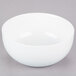 A white 10 Strawberry Street Royal Coupe soup bowl on a gray surface.