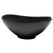 An oval black melamine bowl with curved edges.