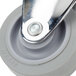A close-up of a grey Cambro 3" fixed caster wheel with a silver metal handle and knob.