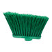 A Carlisle green broom head with long bristles.