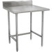 A stainless steel Advance Tabco work table with legs.