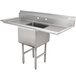 A stainless steel Advance Tabco one compartment sink with two drainboards.