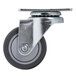 A black metal swivel caster with a metal wheel and round metal plate.