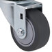 A black rubber swivel caster with a steel center.