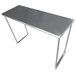 A stainless steel table mounted overshelf over a metal table.