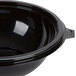 A black Fineline plastic bowl with a lid.
