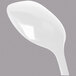 A white spoon with a white handle on a grey background.