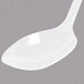 A white spoon with a handle.